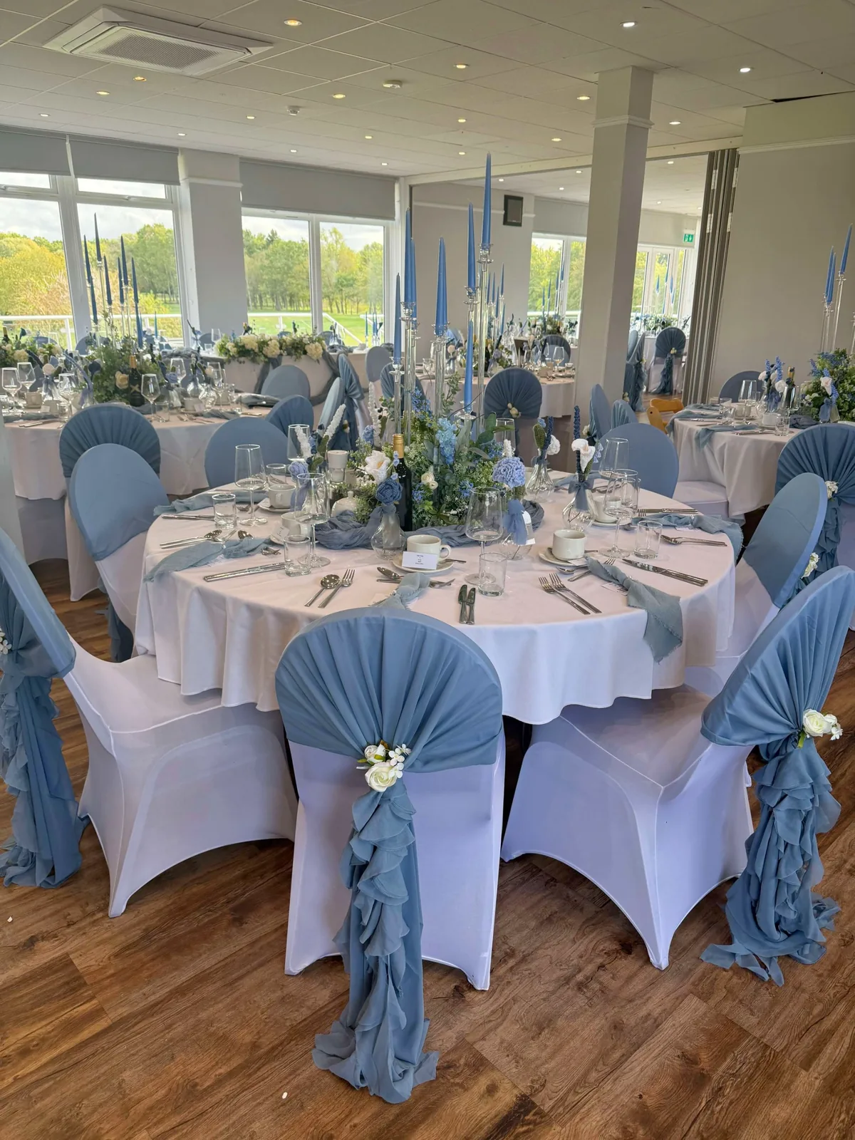 Venue Hire & Events 8 Wedding table with candelabra and blue flowers at Brampton Park Golf Club