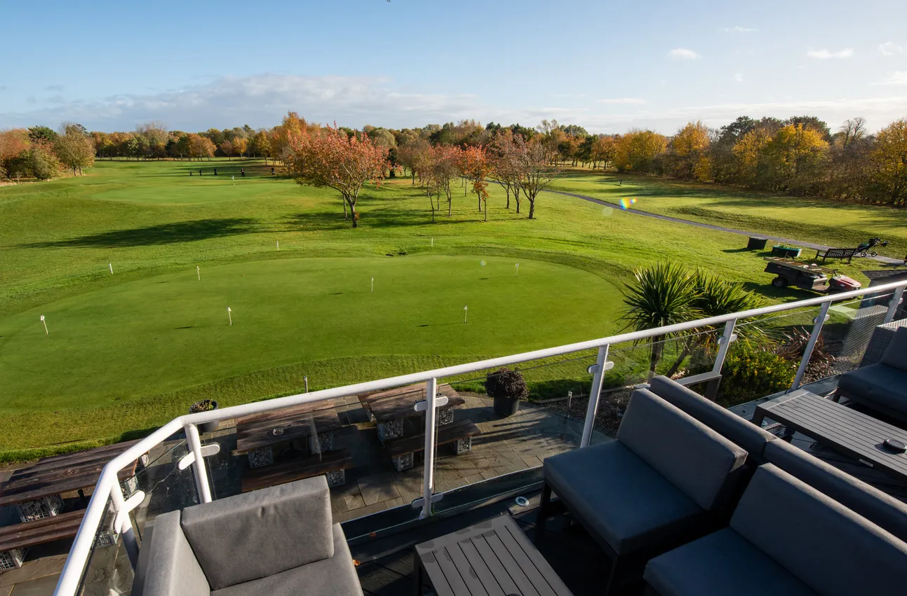 First-floor balcony with seating overlooking the golf course at Brampton Park Golf Club